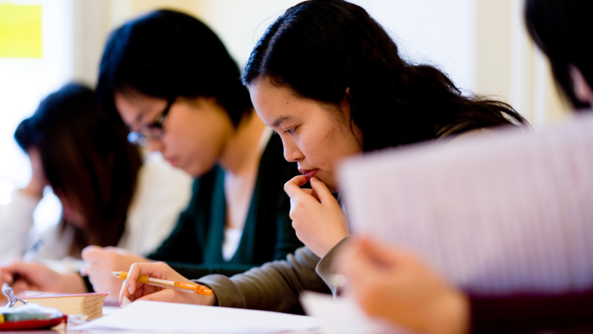 Students writing a test.